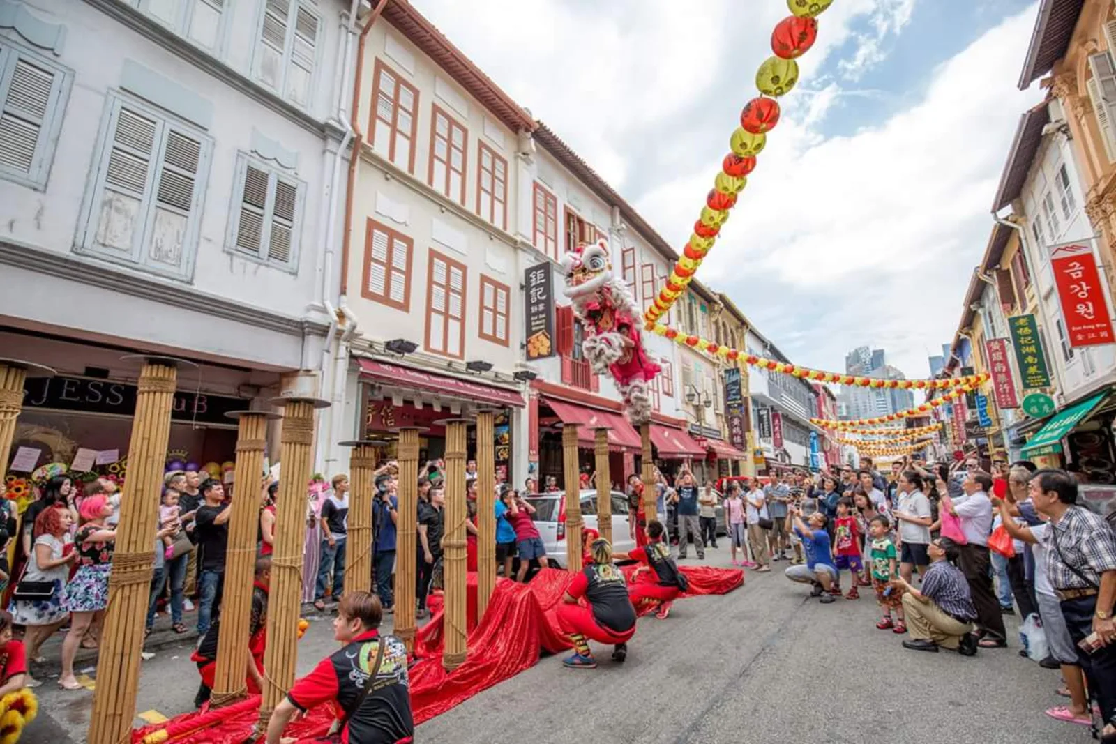 Lion dance high pole performance during Chinese New Year celebrations in Chinatown, Singapore